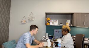 A man getting a Hearing Aid Evaluation by Dr. Elly Pourasef or Dr. Crystal Wiggins